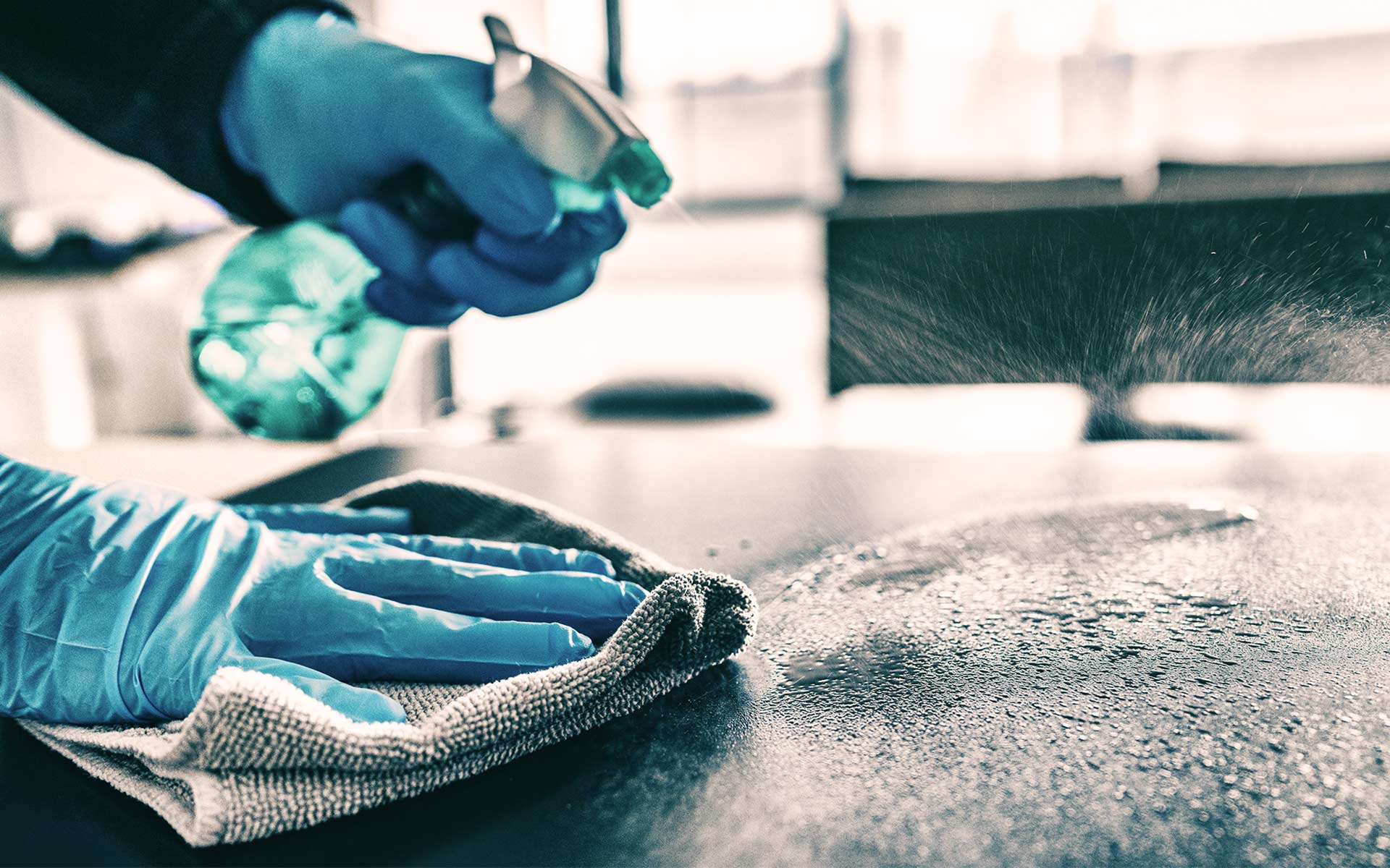 Disinfection & Hygiene - Technician sanitizing surfaces